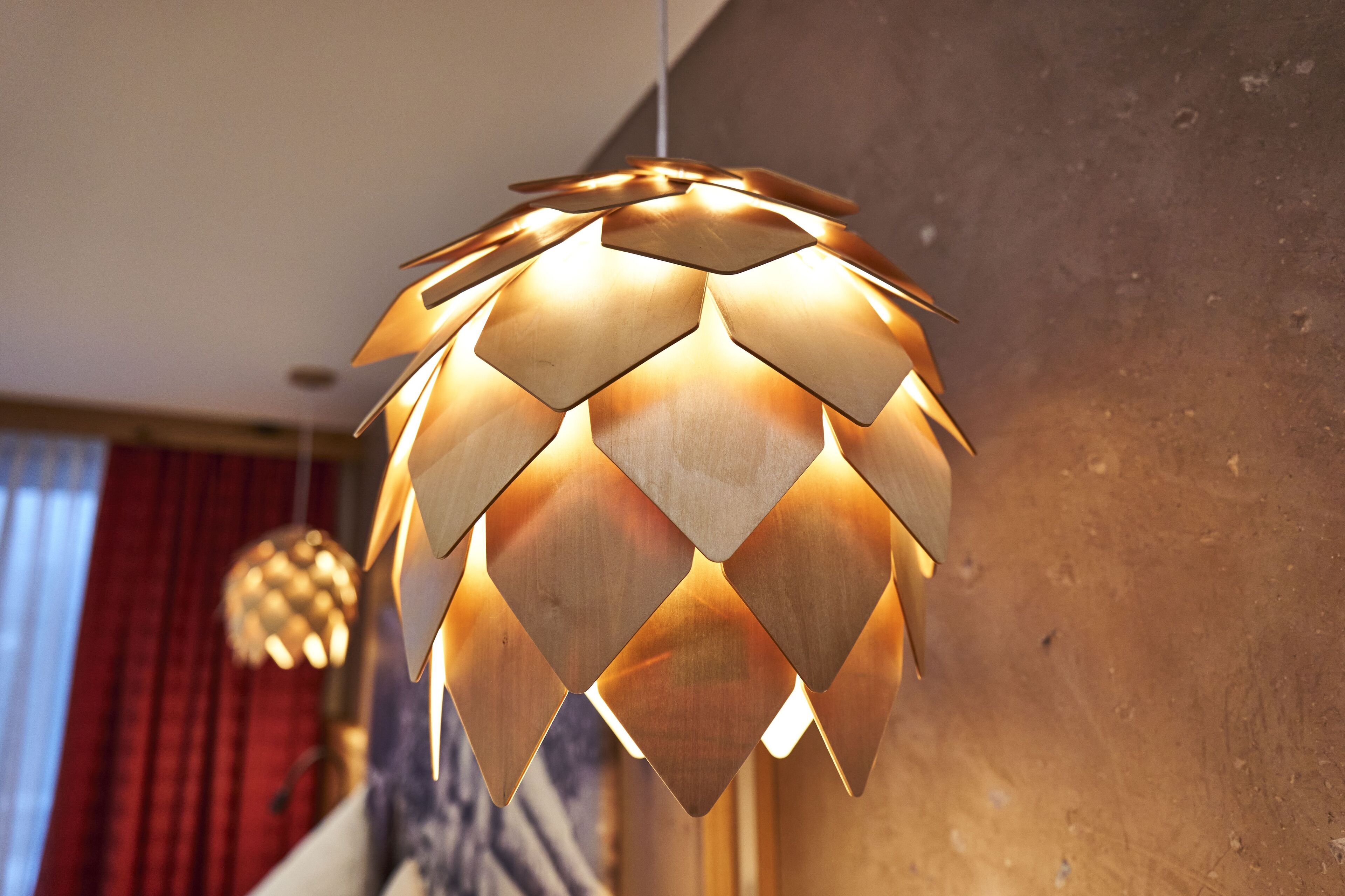 A modern pendant light fixture with a geometric design.