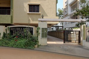 A gated entrance with a sign reading "SHUBHA SQUARE VILLAGE."