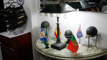 A table with flags, a lamp, and a globe.