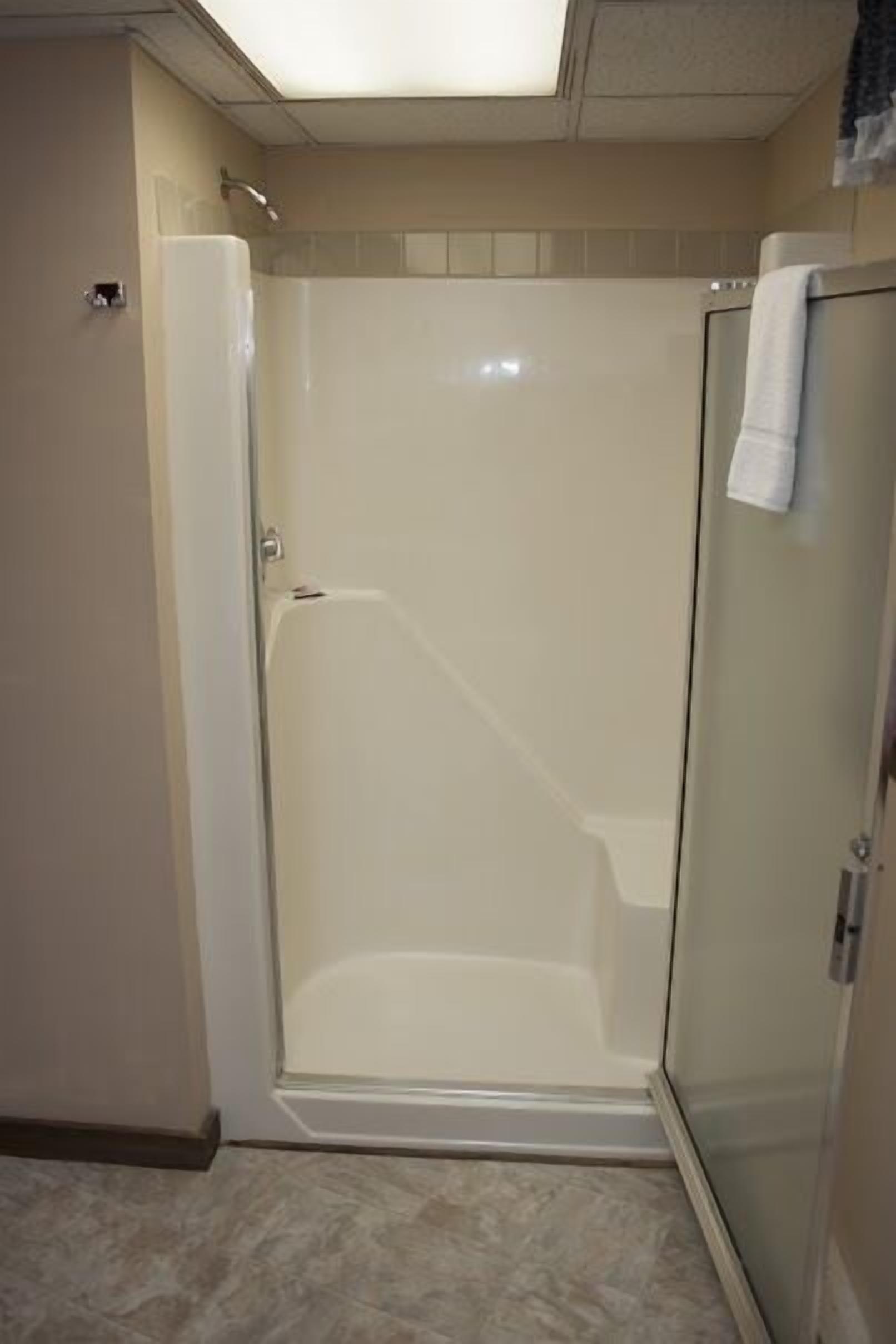 Air Conditioned Motel Suite, Non Smoking | Bathroom | Combined shower/bathtub, free toiletries, towels