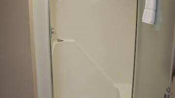 Air Conditioned Motel Suite, Non Smoking | Bathroom | Combined shower/bathtub, free toiletries, towels