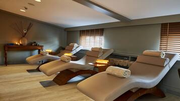 Relax in comfort with three reclining massage chairs, towels at the ready.