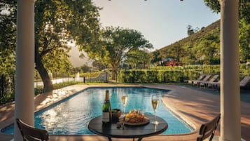 Outdoor pool, pool umbrellas, pool loungers