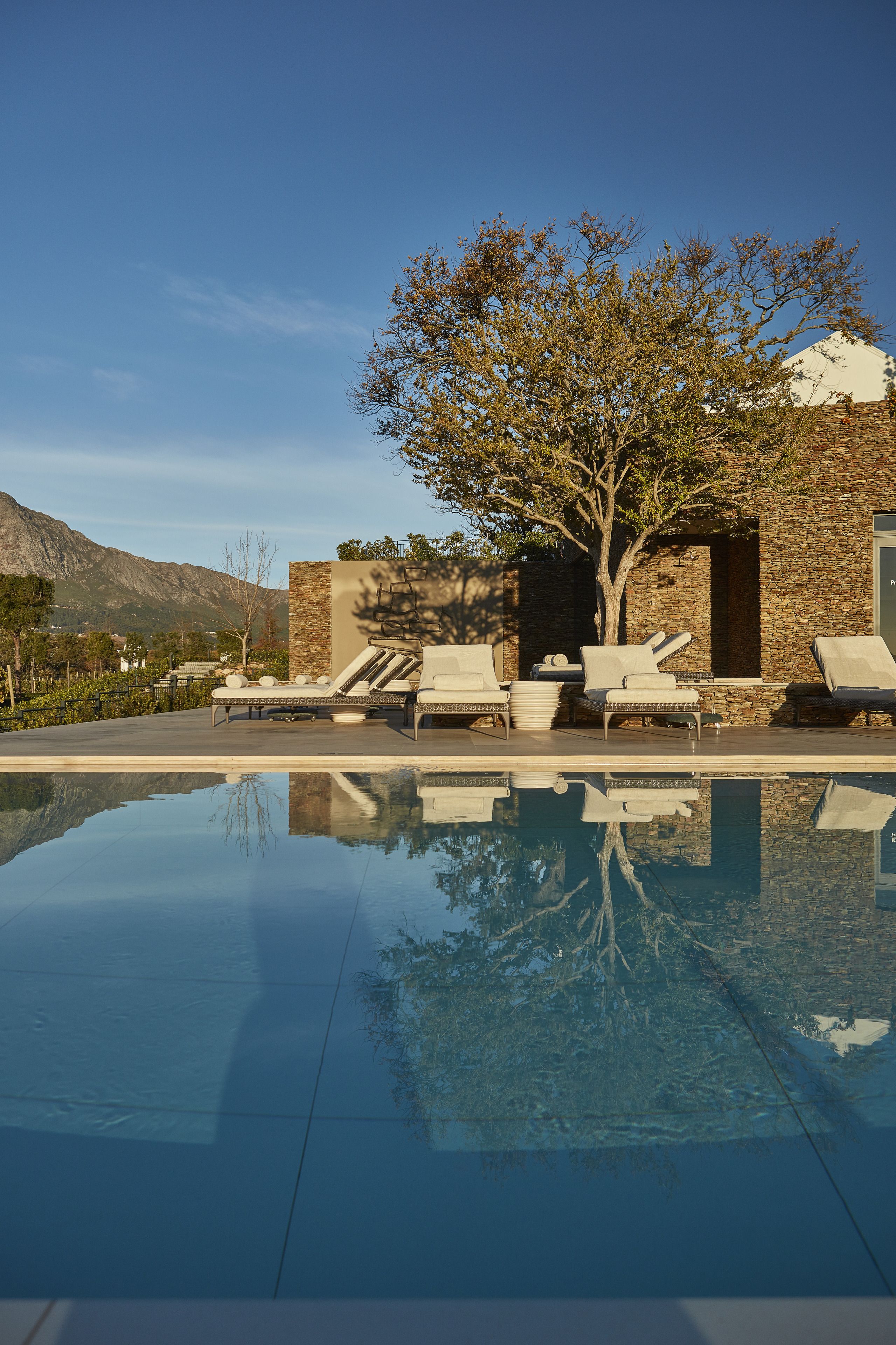 outdoor pool, pool umbrellas, pool loungers