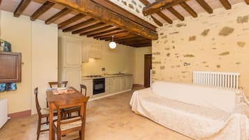 Apartment, 1 Bedroom (Olio) | Living area | Flat-screen TV
