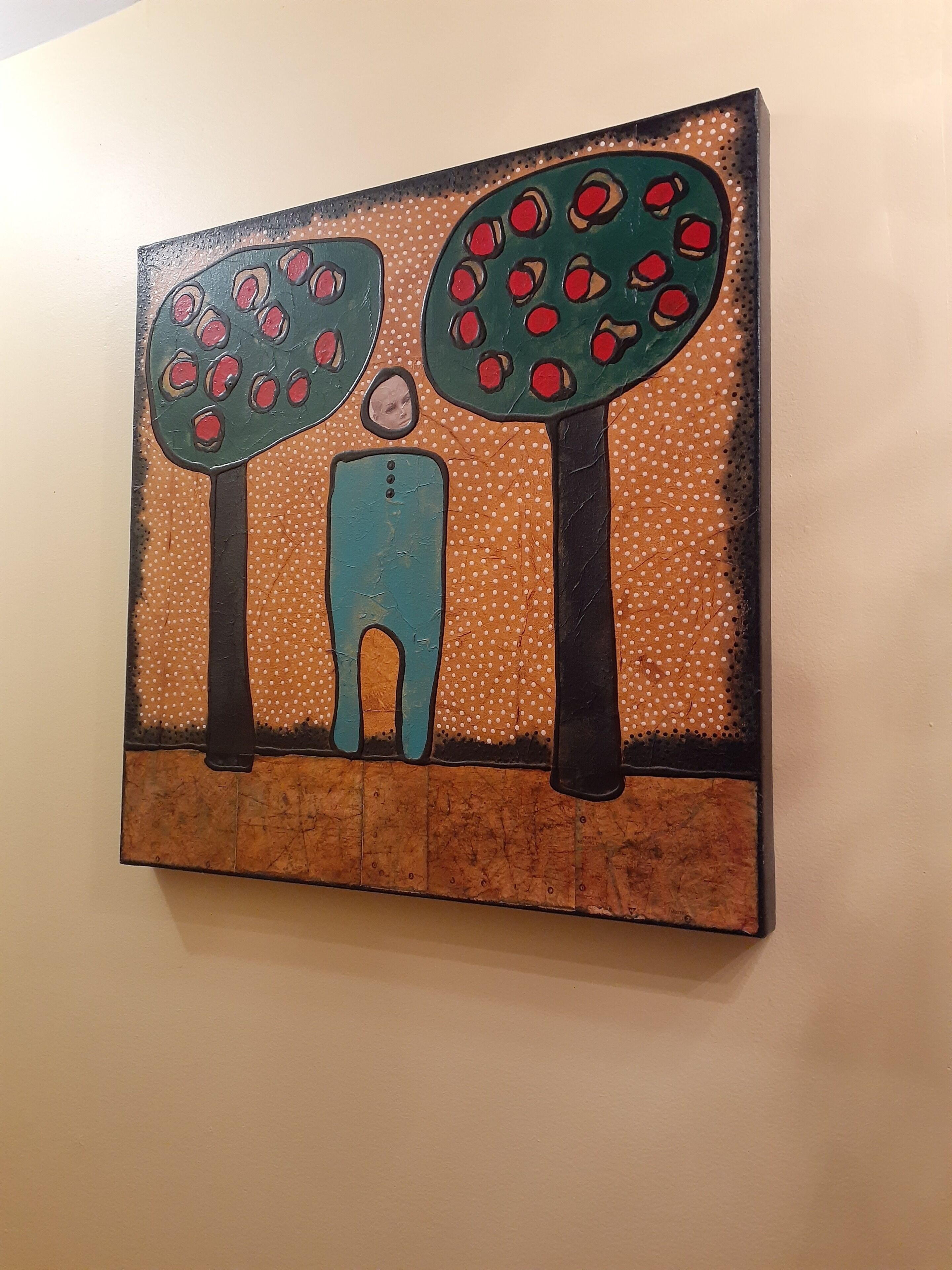 A painting of a figure standing between two trees with red fruits, on a textured background.