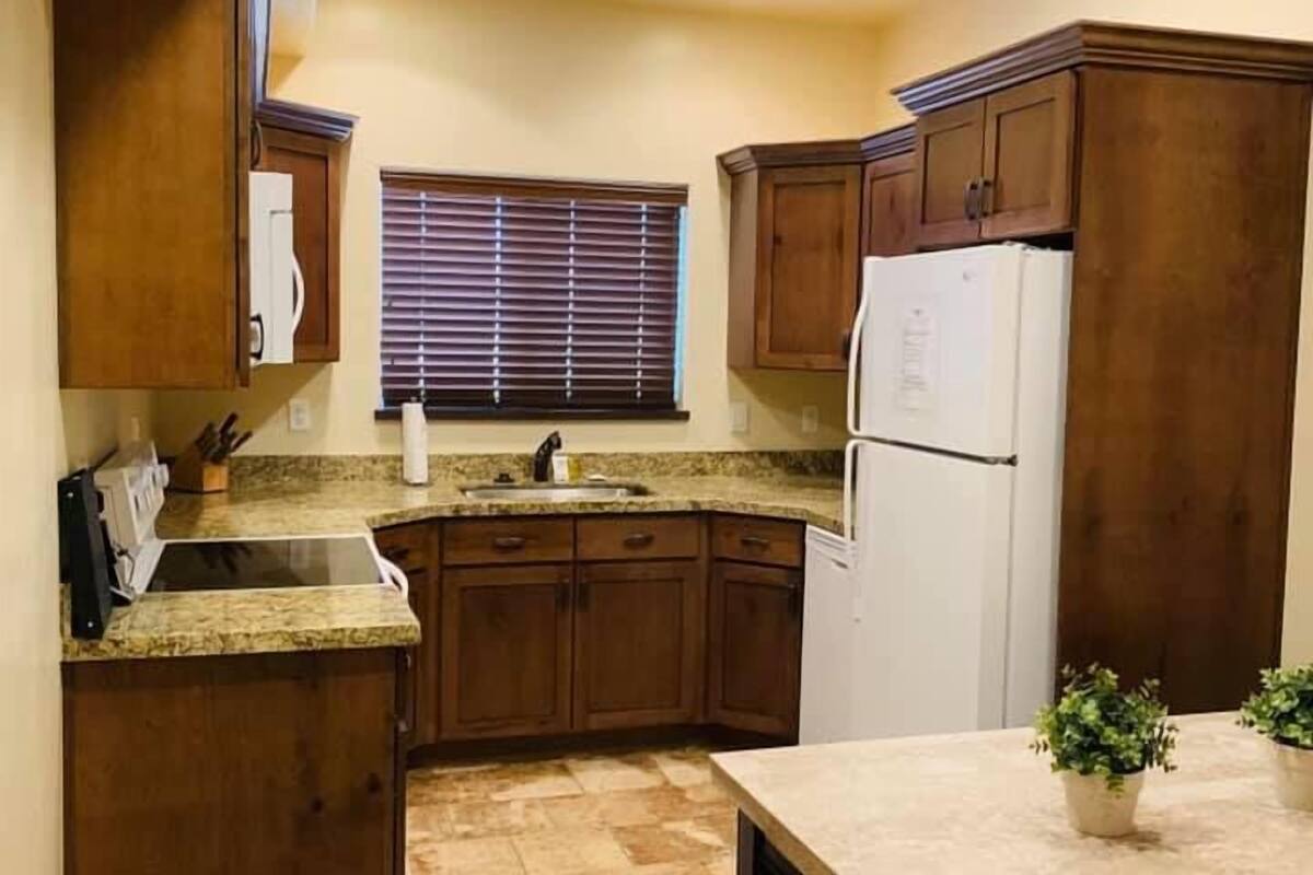 executive townhome, multiple bedrooms, non smoking, pool access | private kitchen | full-sized fridge, microwave, coffee/tea maker, toaster