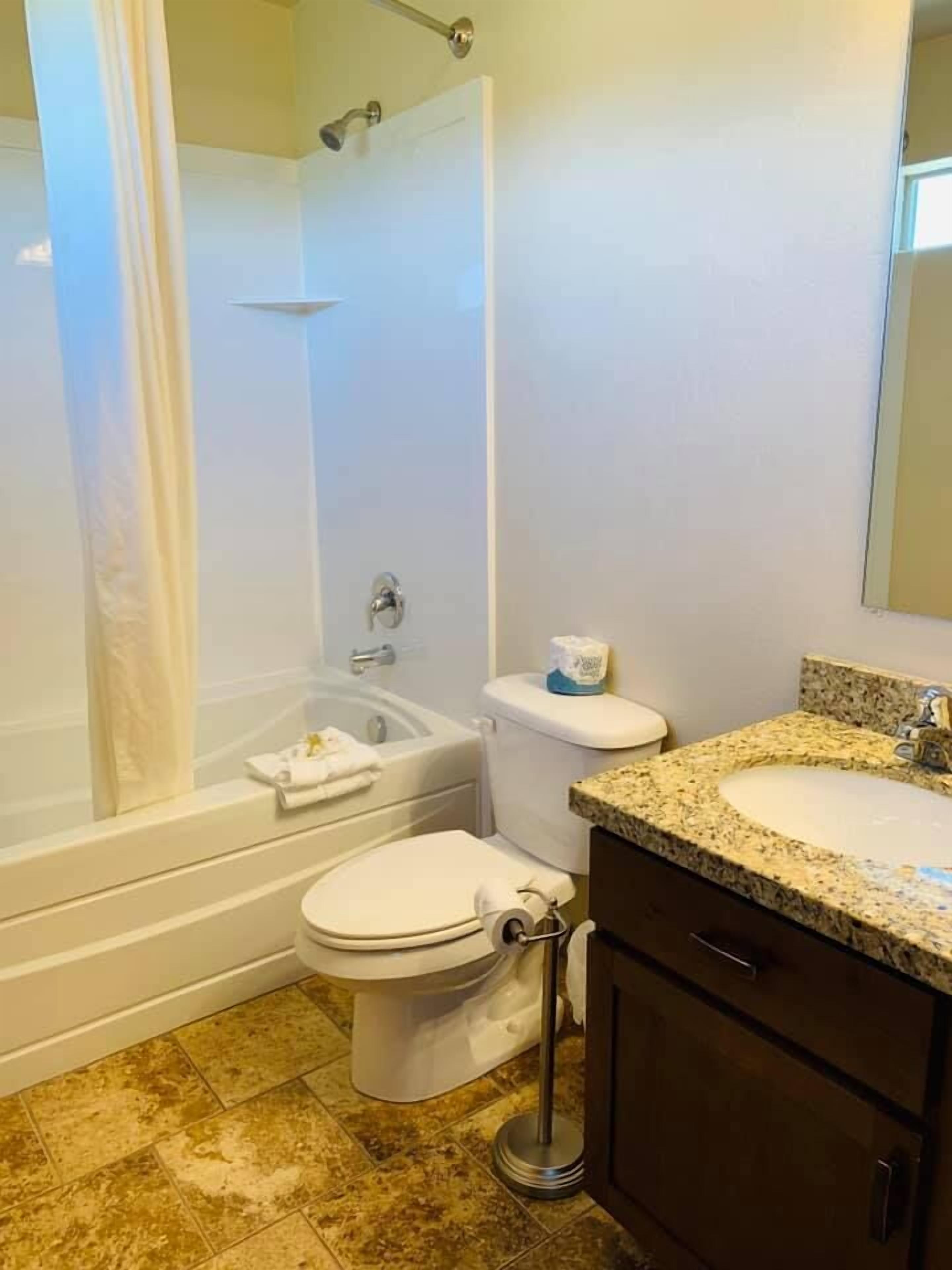 executive townhome, multiple bedrooms, non smoking, pool access | bathroom | combined shower/bathtub, deep-soaking bathtub, free toiletries