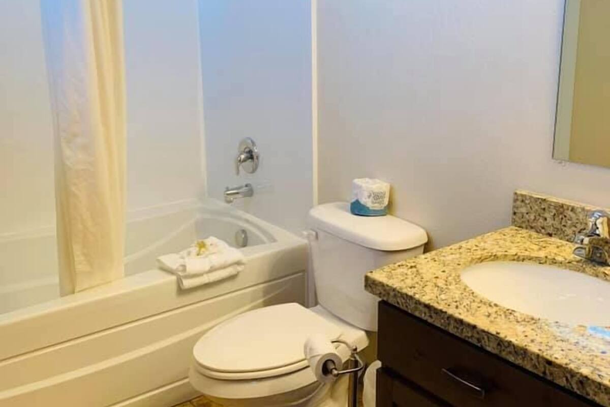 executive townhome, multiple bedrooms, non smoking, pool access | bathroom | combined shower/bathtub, deep-soaking bathtub, free toiletries