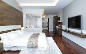 A modern hotel room with a large bed, a TV, and a mirror. -  Eco Luxury Hotel Hanoi (Hanoi)