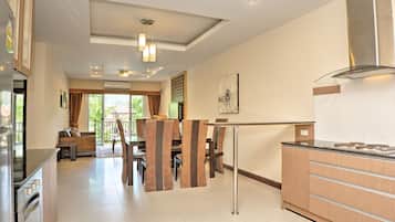Grand Suite, 2 Bedrooms, Pool Access, Pool View | Living area | 32-inch plasma TV with cable channels, TV, DVD player
