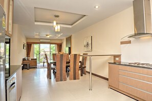 Grand Suite, 2 Bedrooms, Pool Access, Pool View | Living area | 32-inch plasma TV with cable channels, TV, DVD player