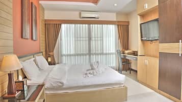 Deluxe Suite, 1 King Bed, Terrace, Pool View | In-room safe, desk, rollaway beds