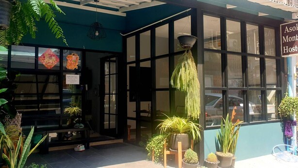 A corner of a building with a sign reading "Asok Monti Hostel". - Asoke Montri Hostel (Bangkok)