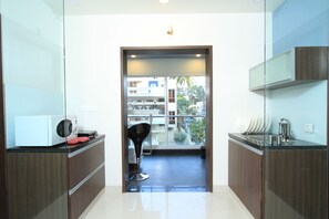 Suite | Cocina privada | Microondas y cafetera y tetera 