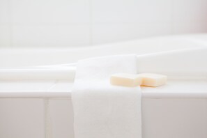 A white bathtub with two soap bars. - Itoku 1 (Kutchan)