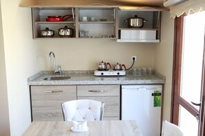 Fridge, stovetop, cookware/dishes/utensils