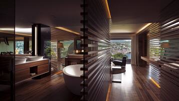 A modern bathroom with a large bathtub, wooden slats, and a view of the city.