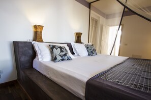 Junior Suite, 1 Bedroom, Garden View, Garden Area | 1 bedroom, in-room safe, desk, cribs/infant beds - Uzuri Boutique Hotel (Jambiani)