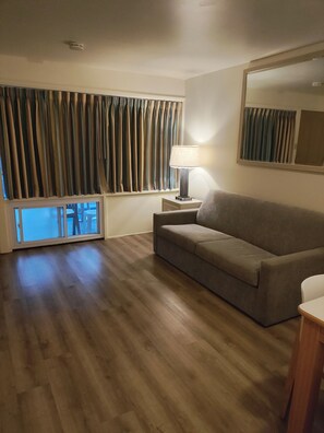 Deluxe Suite, Pool View (Type 6) | Living area | 32-inch flat-screen TV with cable channels, TV