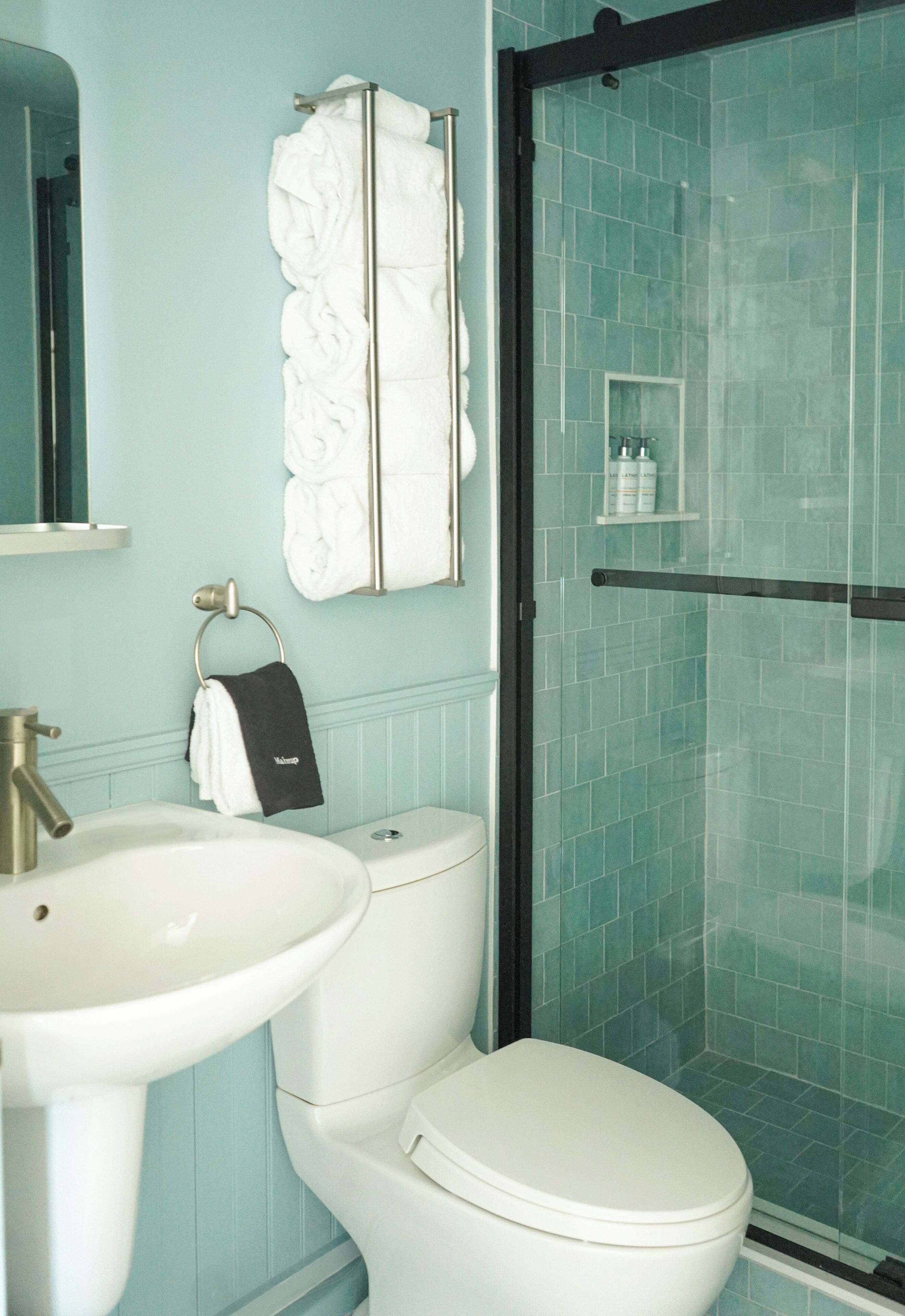 combined shower/bathtub, designer toiletries, hair dryer, bathrobes