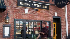 A brick building with a sign reading "Bistro + Wine Bar". - The Bow Hotel (Portsmouth)