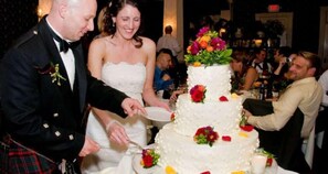 A wedding cake with multiple tiers and floral decorations.