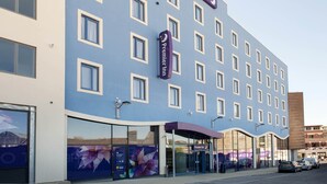 A hotel with a modern facade, multiple windows, and a prominent sign indicating it is a Premier Inn. - Premier Inn Dorchester (Dorchester)