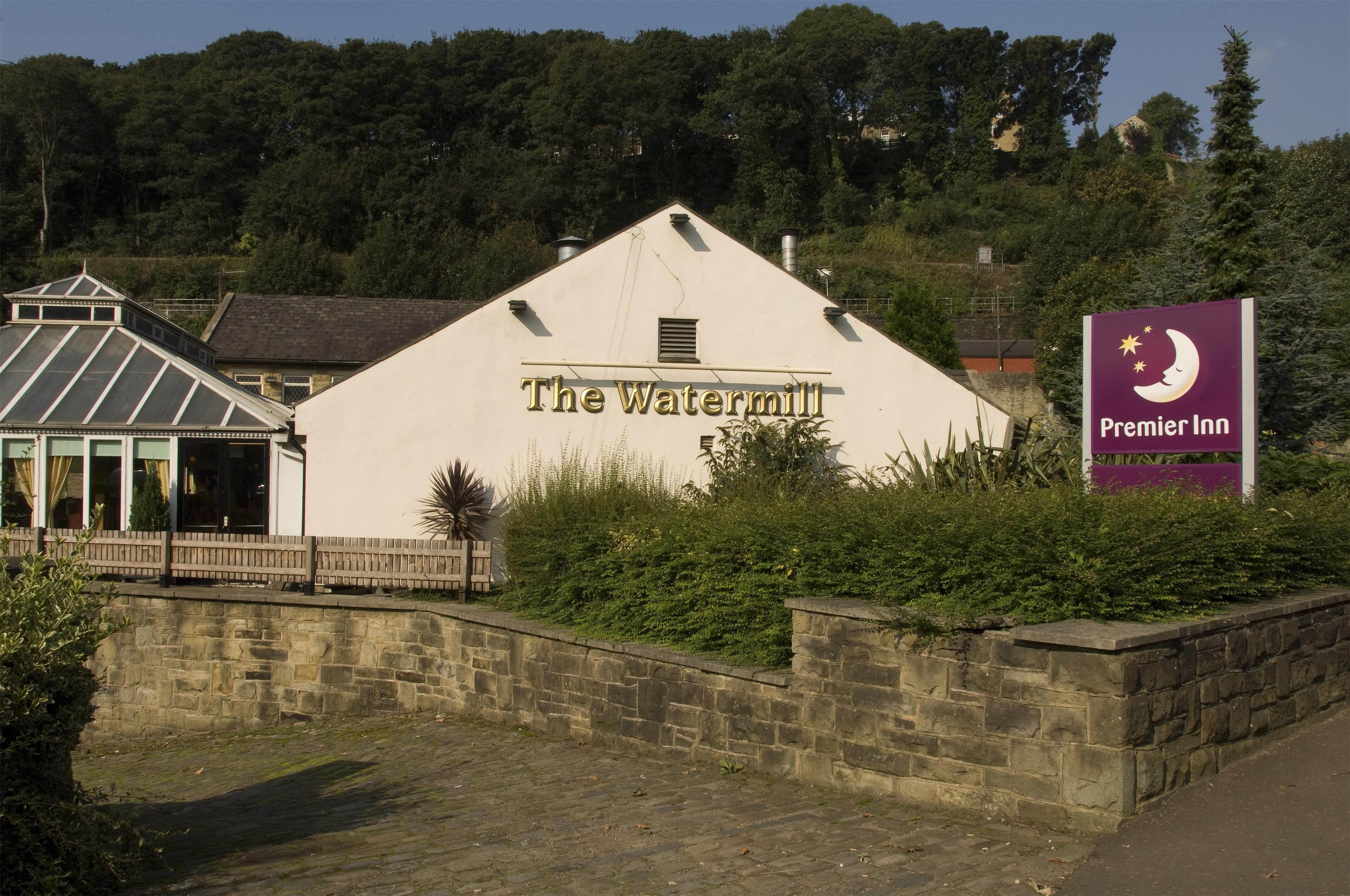 A building labeled 'The Watermill' with a sign for 'Premier Inn' nearby.