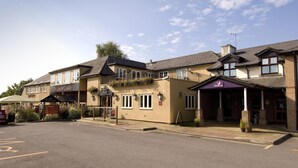 A building with a sign for 'Walston Castle Restaurant' and 'Premier Inn.' - Premier Inn Cardiff West (Cardiff)