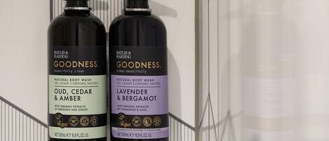 Two bottles of Baylis & Harding Goodness body wash.