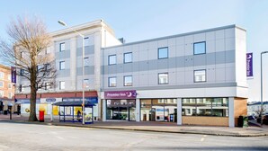 A modern hotel with a flat facade, large windows, and a prominent Premier Inn sign. - Premier Inn Eastbourne Town Centre (Eastbourne)