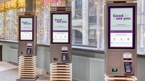 A hotel check-in kiosk with a 'Good to see you' message, a QR code, and a digital screen for finding reservations. - Premier Inn Glasgow City - George Square (Glasgow)