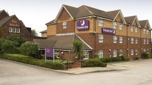 A hotel with a prominent Premier Inn sign, a reception area, and a parking lot. - Premier Inn Rotherham East - M18/M1 (Rotherham)