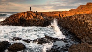 A rocky coastal area with waves crashing against a stone wall. - ibis Coleraine Riverside (Coleraine)