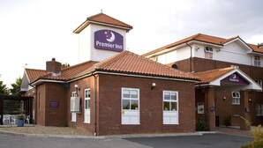 A brick building with a sign reading 'Premier Inn' and a smaller sign below it. - Premier Inn Chelmsford - Springfield (Chelmsford)