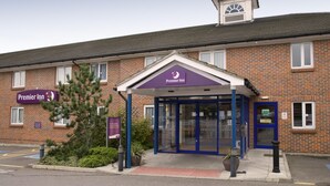 A Premier Inn hotel entrance with a brick facade, a covered entrance area, and a signboard. - Premier Inn Basildon - Rayleigh (Rayleigh)