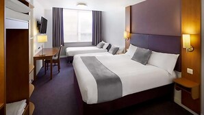 A hotel room with two beds, a desk, a chair, and a TV. - Plaza Hotel, Chorley, Sure Collection by Best Western (Chorley)