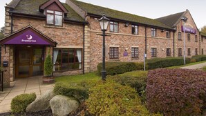 A brick building with a sign for Premier Inn. - Premier Inn Rochdale (Rochdale)