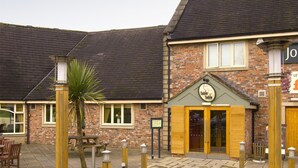 A brick building with a sign reading 'Table Tables.' - Premier Inn Rochdale (Rochdale)