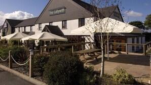 A building named 'The Callwith' with outdoor seating and a covered patio area. - Premier Inn Bodmin (Bodmin)