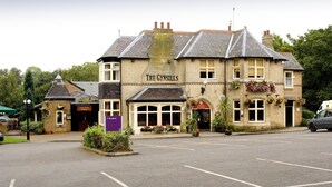 A building with a sign reading 'The Gynsills' and a 'Family Dining' sign below. - Premier Inn Leicester North West (Leicester)