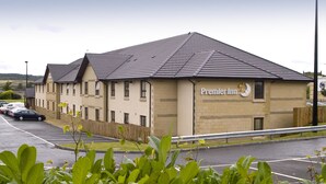 A hotel with a flat roof, multiple windows, and a sign reading 'Premier Inn.' - Premier Inn Dunfermline (Dunfermline)
