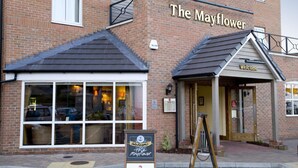 A brick building with a sign reading 'The Mayflower' and a welcome sign outside. - Premier Inn Harwich (Harwich)