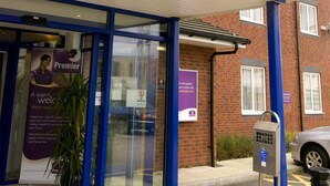 A Premier Inn hotel entrance with a purple awning, glass doors, and a blue frame. - Premier Inn Warrington Central North (Warrington)
