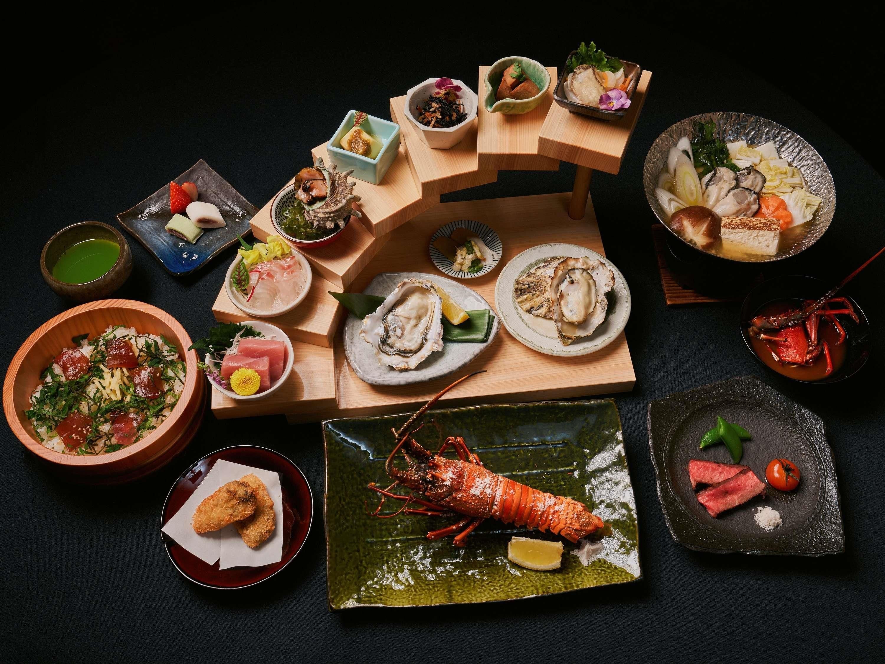 A variety of dishes arranged on wooden tables, including seafood and vegetables.