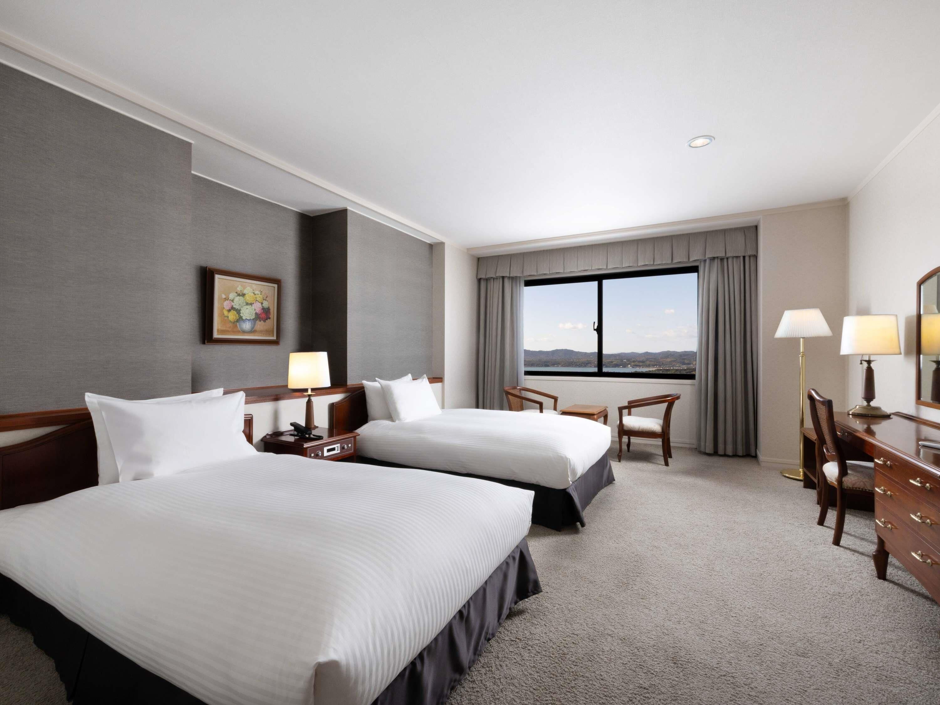 Deluxe Suite, Multiple Beds | In-room safe, blackout drapes, free WiFi, bed sheets