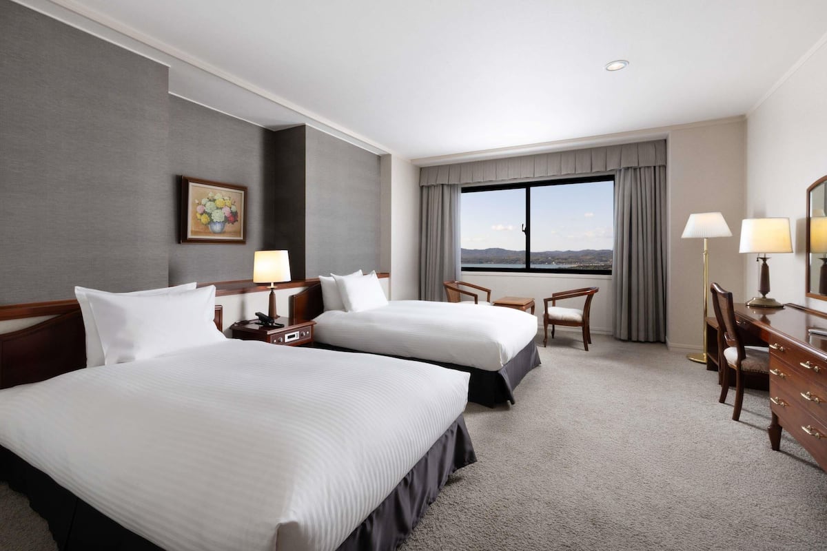 Deluxe Suite, Multiple Beds | In-room safe, blackout drapes, free WiFi, bed sheets