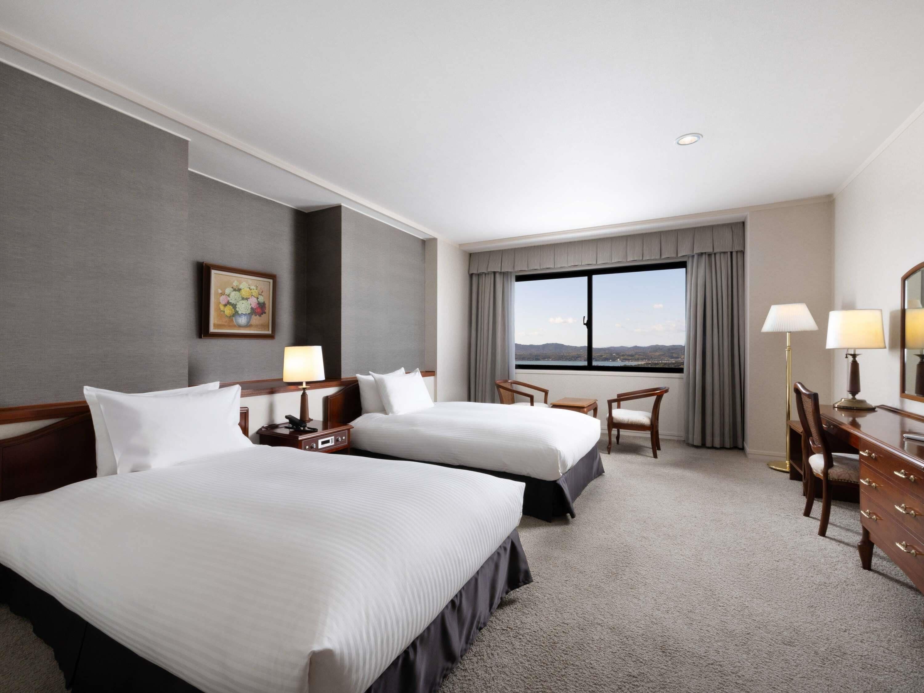 Deluxe Suite, Multiple Beds | In-room safe, blackout drapes, free WiFi, bed sheets