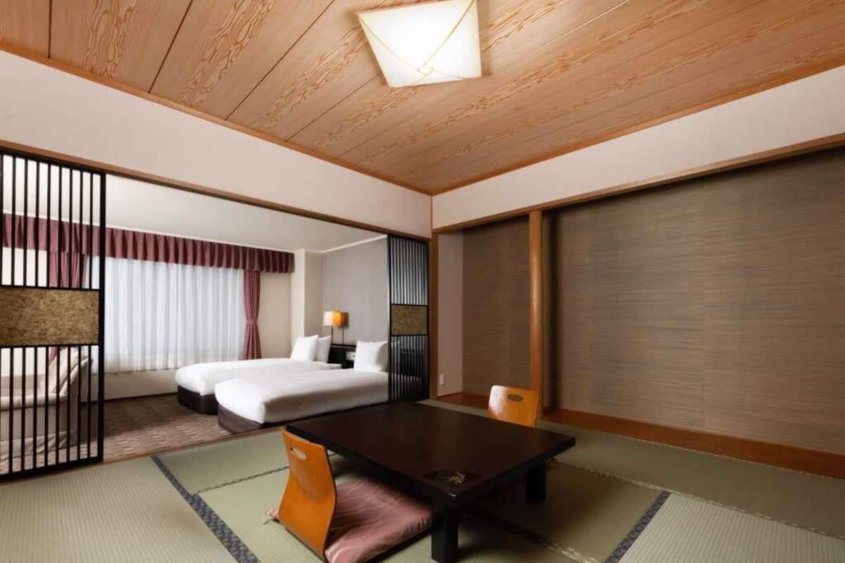Suite clásica, 2 camas individuales | Ropa de cama de alta calidad y caja de seguridad en la habitación